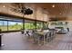 Spacious covered patio with outdoor dining and lounge areas perfect for entertaining at 13450 E Lake Mary Jane Rd, Orlando, FL 32832