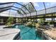 Enclosed pool area featuring pool, hot tub, waterfall and plenty of room for seating at 13450 E Lake Mary Jane Rd, Orlando, FL 32832