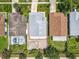 Aerial view of the property showing the layout, patio, pool nearby, and proximity to neighboring homes at 1437 Abberton Dr, Orlando, FL 32837