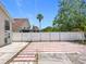 Large fenced backyard with a concrete slab and view of surrounding houses at 1437 Abberton Dr, Orlando, FL 32837
