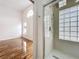View from bedroom to glass enclosed shower with square tile block at 1437 Abberton Dr, Orlando, FL 32837