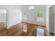 Bright bedroom boasts glossy wood floors and lots of natural light from windows at 1437 Abberton Dr, Orlando, FL 32837