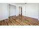 A bedroom featuring wood-look floors, a closet, and access to a bathroom at 1437 Abberton Dr, Orlando, FL 32837