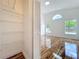 Bright bedroom boasts glossy wood floors, walk-in closet, and lots of natural light from large windows at 1437 Abberton Dr, Orlando, FL 32837