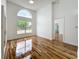Bedroom featuring hardwood floors, high ceilings, and large windows at 1437 Abberton Dr, Orlando, FL 32837