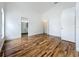 Large bedroom with glossy wood floors leads to bathroom and closet at 1437 Abberton Dr, Orlando, FL 32837