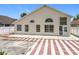 Charming home exterior with modern windows and a unique red-and-white brick patio, perfect for outdoor living at 1437 Abberton Dr, Orlando, FL 32837
