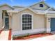 Close up of a charming single-Gathering home with decorative garden at 1437 Abberton Dr, Orlando, FL 32837