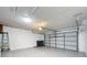 Spacious two car garage featuring an automatic door and extra storage at 1437 Abberton Dr, Orlando, FL 32837
