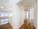 Hallway with hardwood floors and access to multiple rooms, including the living area at 1437 Abberton Dr, Orlando, FL 32837