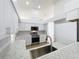 Bright kitchen with stainless steel appliances, granite countertops, and ample cabinet space at 1437 Abberton Dr, Orlando, FL 32837
