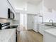 Modern kitchen showcasing white cabinets, marble countertops, and stainless steel appliances at 1437 Abberton Dr, Orlando, FL 32837