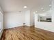 Bright living space featuring wood floors, white walls, and seamlessly connected to the kitchen at 1437 Abberton Dr, Orlando, FL 32837