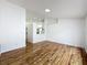 Open-concept living area with hardwood floors, and a seamless transition to the kitchen at 1437 Abberton Dr, Orlando, FL 32837