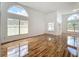 Bright living space featuring high ceilings, hardwood floors, and ample natural light at 1437 Abberton Dr, Orlando, FL 32837