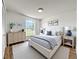 Inviting bedroom featuring hardwood floors, a large window, neutral decor, and ample natural light at 1437 Abberton Dr, Orlando, FL 32837