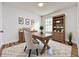 Inviting home office featuring wood furniture, a window with natural light, and stylish decor at 1437 Abberton Dr, Orlando, FL 32837