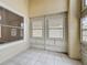 Enclosed porch with ceramic tile flooring and windows for natural light at 1437 Abberton Dr, Orlando, FL 32837