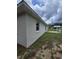 The home's exterior showing the yard and patio area in the backyard at 860 S Grove St, Eustis, FL 32726