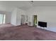 Bright living room area featuring neutral walls and an open floor plan at 860 S Grove St, Eustis, FL 32726