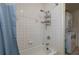 Small bathroom with shower and tub, and washer/dryer at 815 E Church St, Bartow, FL 33830