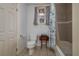 Bathroom with toilet, tub shower combo, and stained glass window at 815 E Church St, Bartow, FL 33830