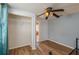 Bedroom with ceiling fan, closet, and wood-look floors at 815 E Church St, Bartow, FL 33830