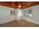 Bedroom with wood ceiling, ceiling fan and exterior access at 815 E Church St, Bartow, FL 33830