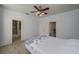 Bedroom with double bed, access to bathroom, and ceiling fan at 815 E Church St, Bartow, FL 33830