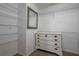 Walk-in closet with wire shelving and dresser at 815 E Church St, Bartow, FL 33830