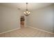 Dining room with chandelier and view into kitchen at 815 E Church St, Bartow, FL 33830