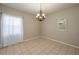 Dining room with chandelier, mirror, and tile floor at 815 E Church St, Bartow, FL 33830