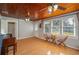 Living room with wood floors, wood ceiling, and two chairs at 815 E Church St, Bartow, FL 33830