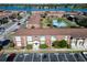 Aerial view of apartment building near tennis court and lake at 1920 E Edgewood Dr # A4, Lakeland, FL 33803