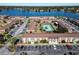 Aerial view of apartment complex near lake and tennis court at 1920 E Edgewood Dr # A4, Lakeland, FL 33803