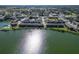 Aerial view of community, lake, and tennis courts at 1920 E Edgewood Dr # A4, Lakeland, FL 33803