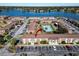 Aerial view highlighting apartment building with tennis court nearby at 1920 E Edgewood Dr # A4, Lakeland, FL 33803