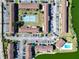 Aerial view of community with tennis court, pool, and ample parking at 1920 E Edgewood Dr # A4, Lakeland, FL 33803