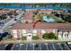 Aerial view of apartment building near tennis court and lake at 1920 E Edgewood Dr # A4, Lakeland, FL 33803