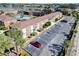 Aerial view of apartment building with parking and tennis court at 1920 E Edgewood Dr # A4, Lakeland, FL 33803