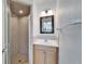 Clean bathroom with shower, vanity, and mirror at 1920 E Edgewood Dr # A4, Lakeland, FL 33803