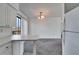 Dining area with carpet and a view of the kitchen at 1920 E Edgewood Dr # A4, Lakeland, FL 33803