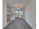 Bright dining area with sliding glass doors leading to a balcony and ocean view at 1920 E Edgewood Dr # A4, Lakeland, FL 33803