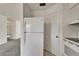 White appliances in a galley style kitchen at 1920 E Edgewood Dr # A4, Lakeland, FL 33803