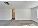 Bright living room with grey carpet and large window at 1920 E Edgewood Dr # A4, Lakeland, FL 33803