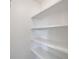 Empty pantry with white shelves at 1920 E Edgewood Dr # A4, Lakeland, FL 33803