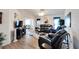 Living room with leather furniture, wood floors, and large windows at 2178 Sunstone Dr, Lakeland, FL 33813