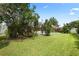 Spacious backyard with mature trees and lawn at 2375 Miles Ct, Lakeland, FL 33812