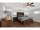 Primary bedroom with hardwood floors and ceiling fan at 2375 Miles Ct, Lakeland, FL 33812