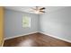 Bright bedroom with wood flooring and ceiling fan at 2375 Miles Ct, Lakeland, FL 33812